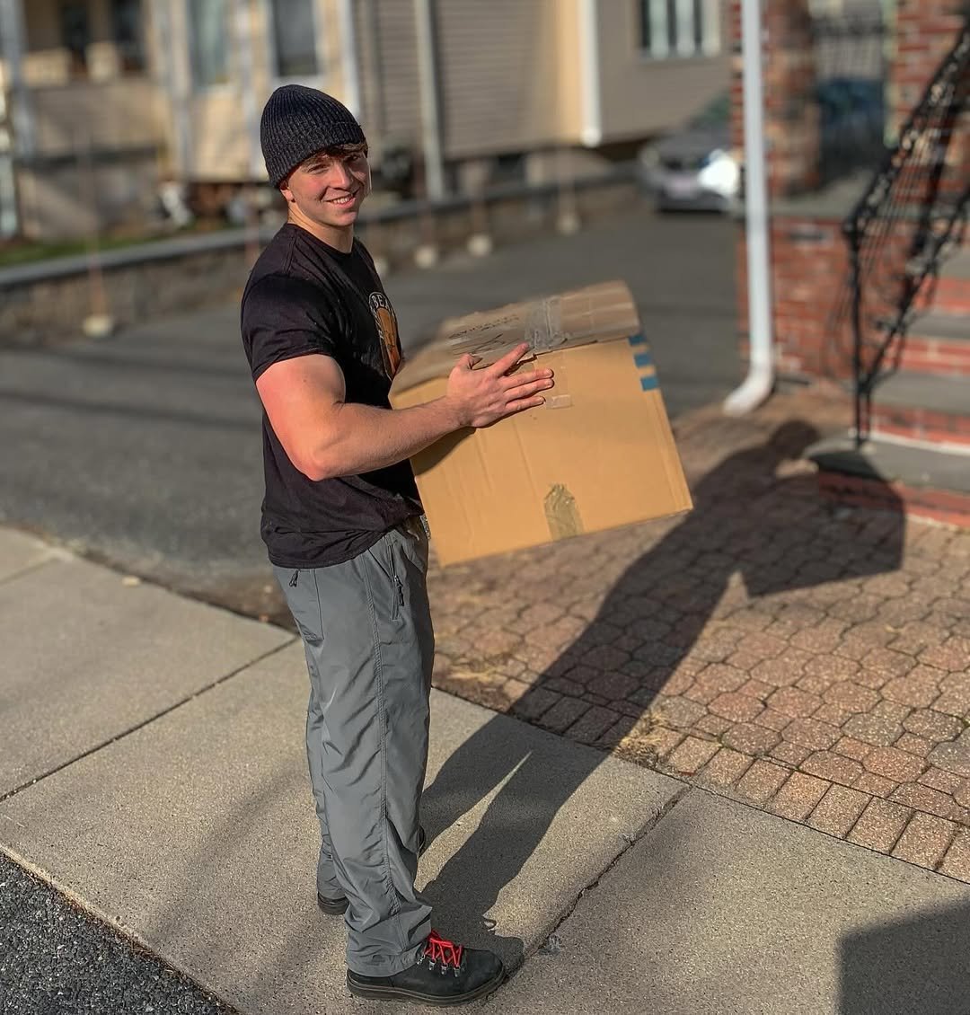 Waltham moving services - Big Bear mover with moving box providing excellent customer service - Big Bear Movers Massachusetts